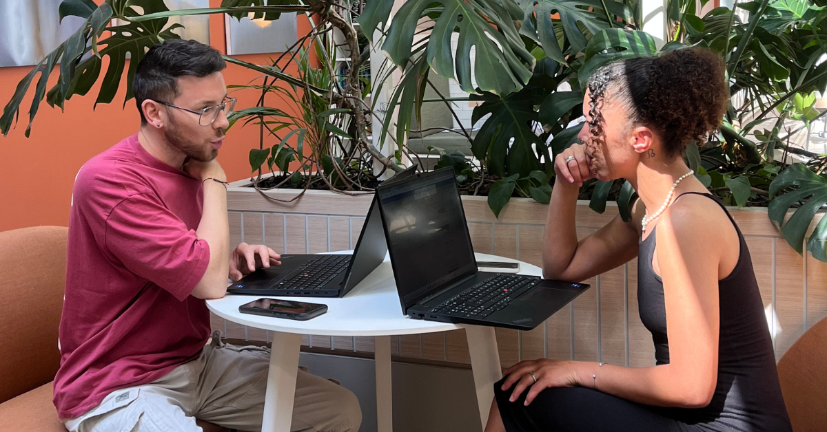 Hannah and Jake working in a coworking spot in the office, unlock strategic value for your company.